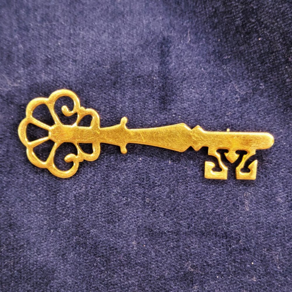 WRE 12 KGF key brooch